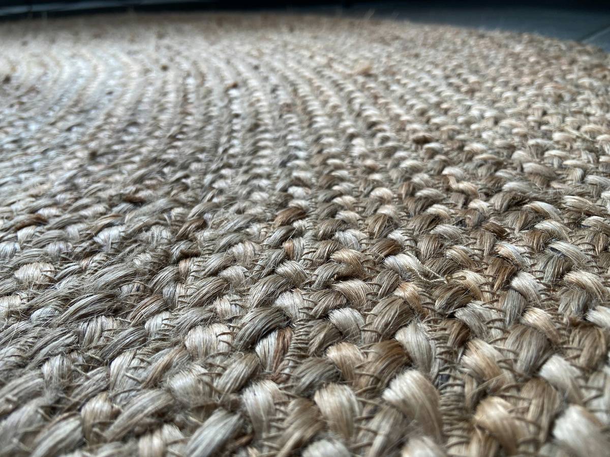 A professional mat splitter tool resting on a grooming table.