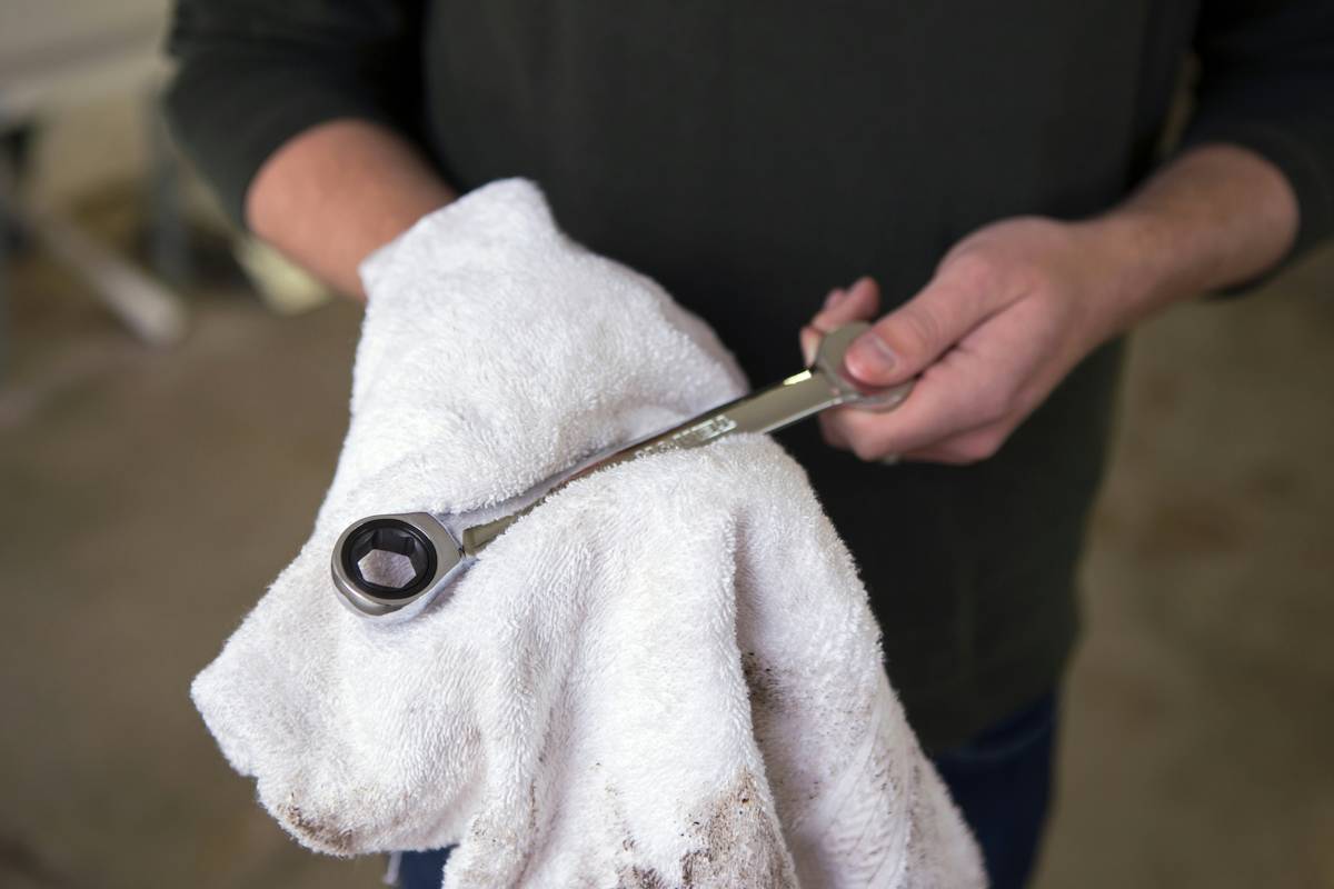 Golden retriever relaxing during a grooming session using a serrated-edge mat splitter